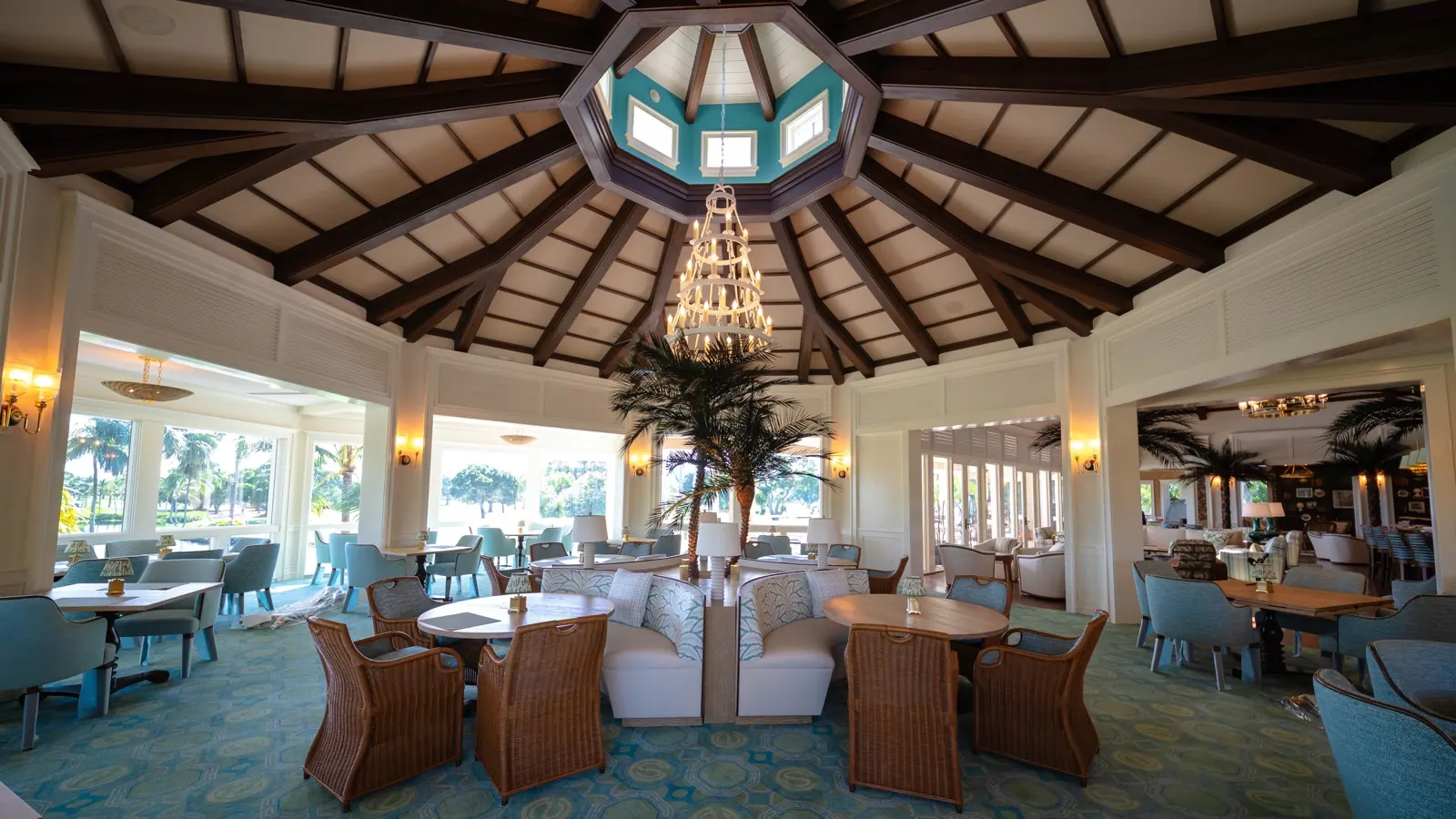 Card Sound Clubhouse lounge, wide view, chandelier and palm centerpiece